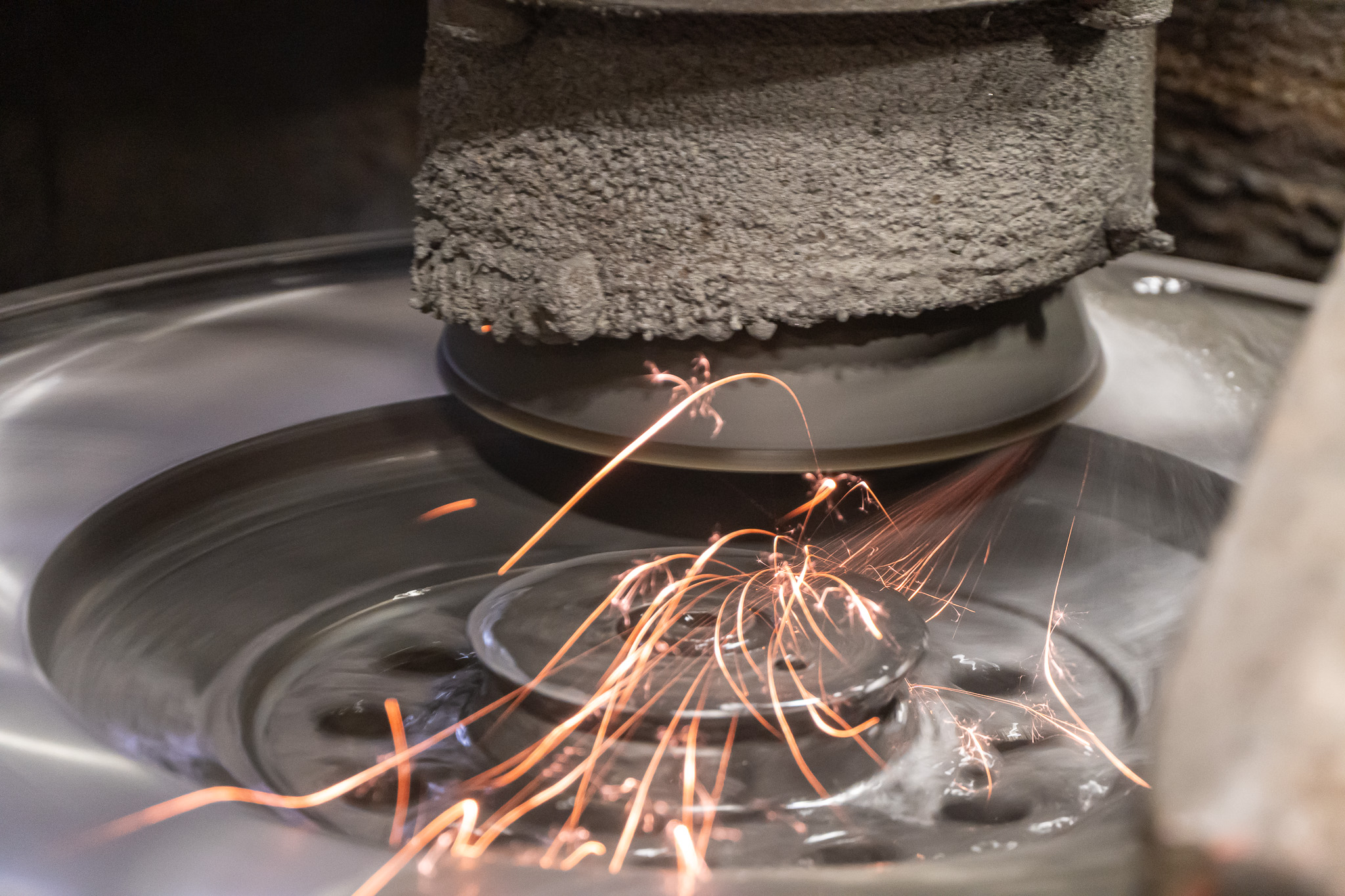 Grinding wheel throwing sparks during precision valve grinding