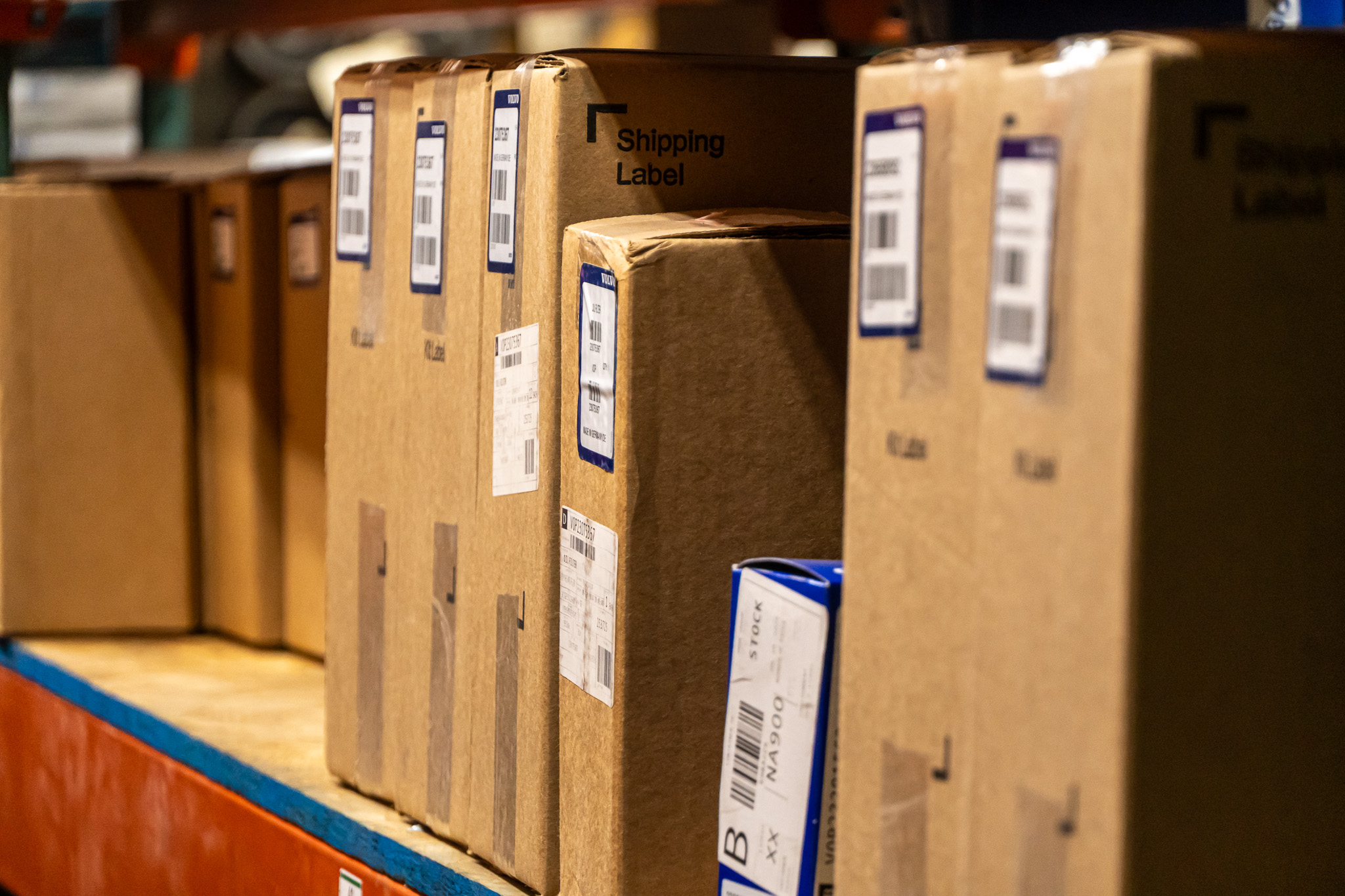 Boxed diesel parts on warehouse shelves